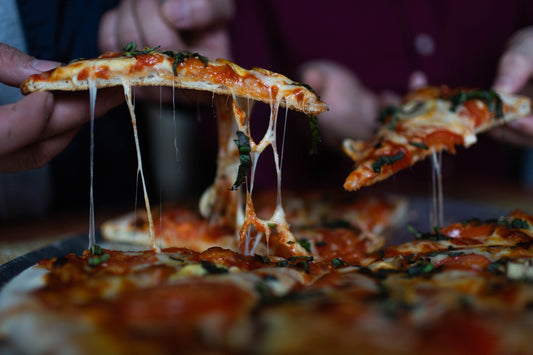 Cheese slices of pizza - The Woodfired Co