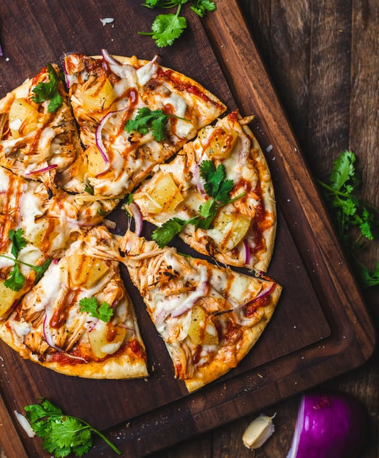 Sliced whole pizza - The Woodfired Co