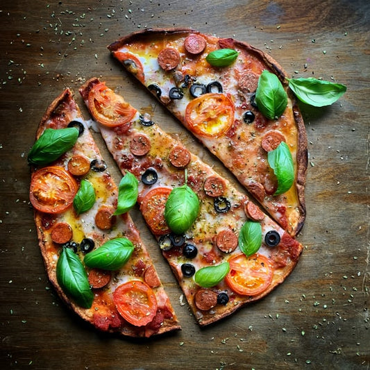 Thin crust pizza sliced - The Woodfired Co