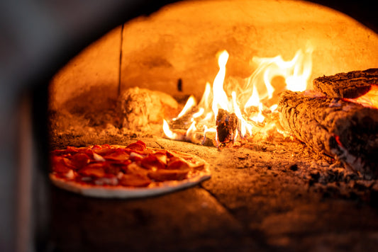 Pizza baked inside a fire oven - The Woodfired Co