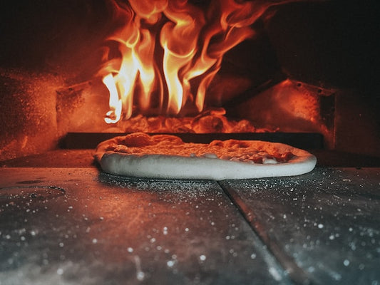 Pizza baked inside a wood fired oven - The Woodfired Co