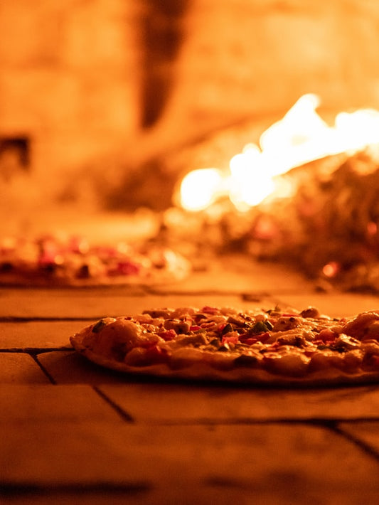 Pizza baked inside a wood fired oven _ The Woodfired Co