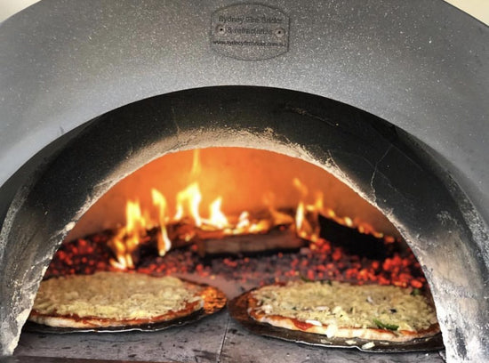 Cheesy oven inside a concrete oven - The Woodfired Co