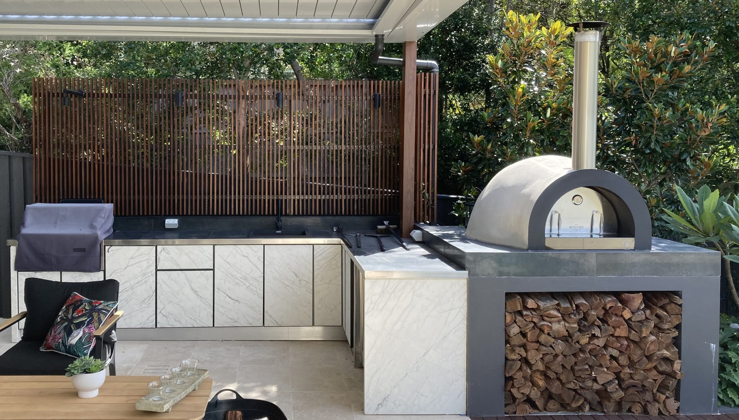 Outdoor kitchen with small wood fire oven - The Woodfired Co